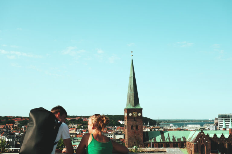 Two people looking over at the Aarhus skyline