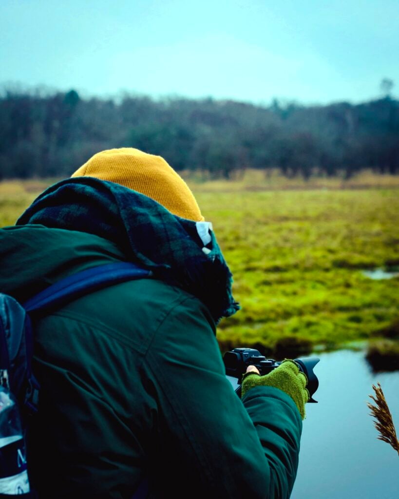 A person taking photos in Amager Fælled, Copenhagen