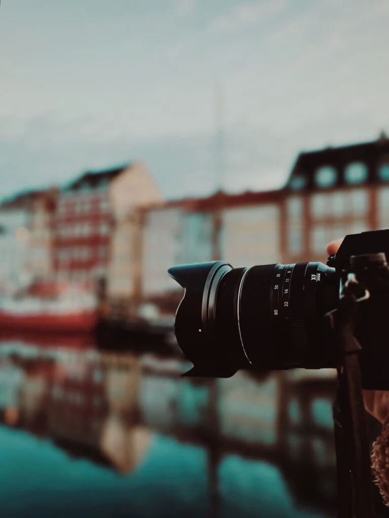 A lens in focus with Nyhavn, Copenhagen in the background