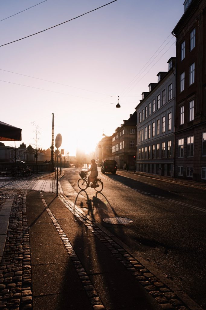 A person cycling in Copenhagen during the winter