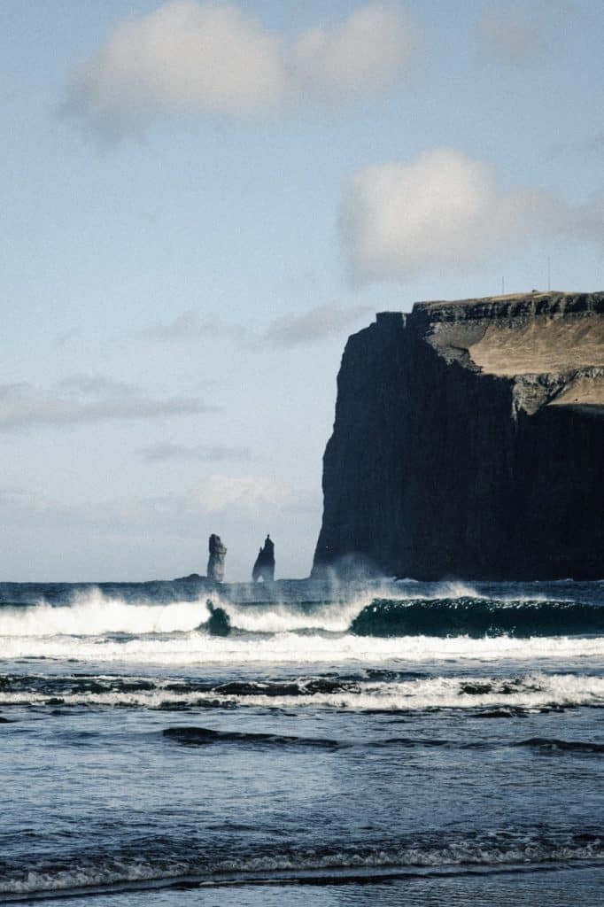 A pair of sea stacks seen from the beach in Tjørnuvík, Faroe Islands