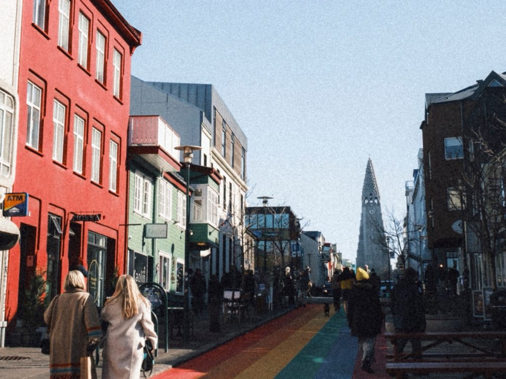 Two people walking along the street in Reykjavík, Iceland