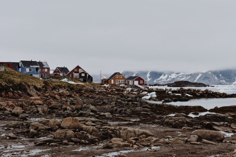 A landscape in Kulusuk, Greenland, along with houses