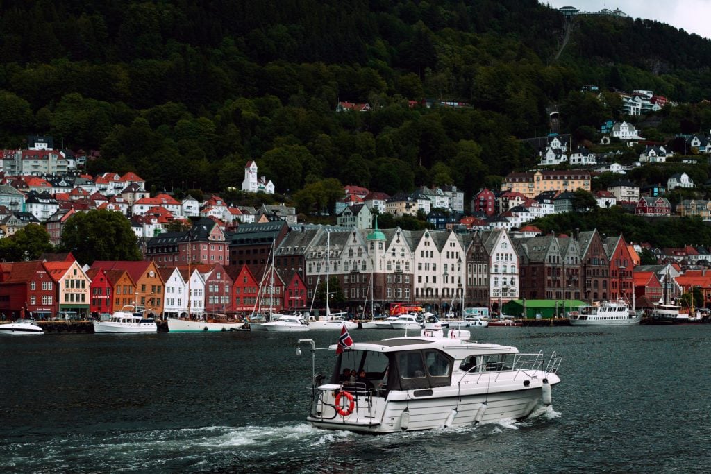 A boat passing through Bryggen in Bergen, Norway