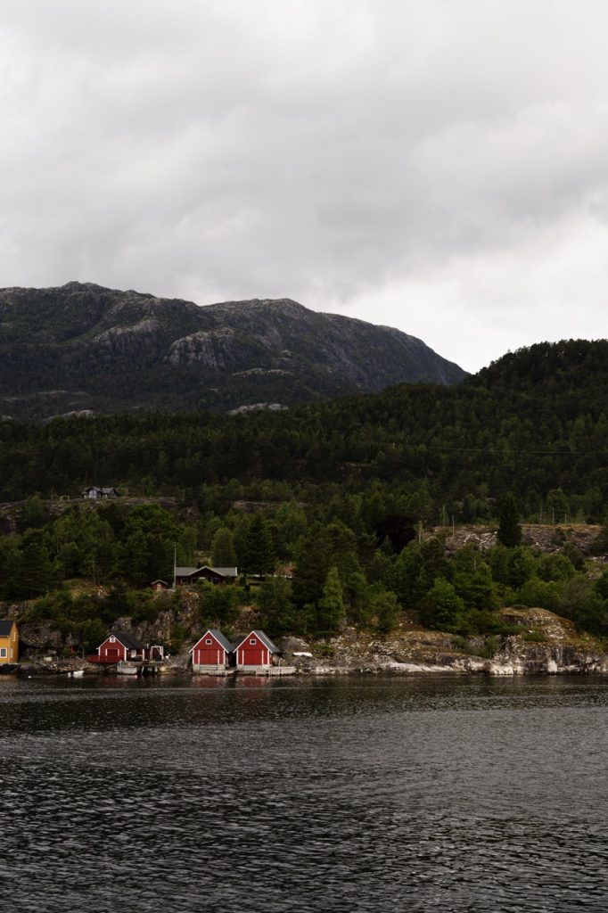 A view of cabins from a fjord tour in Norway