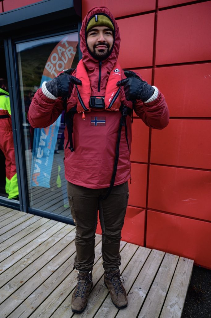 A man with a life jacket for a boat in the Faroe Islands