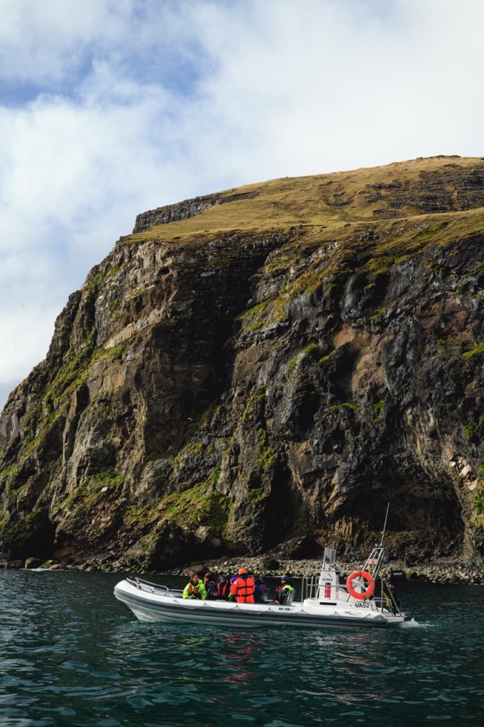 A boat and cliff on the Faroe Islands