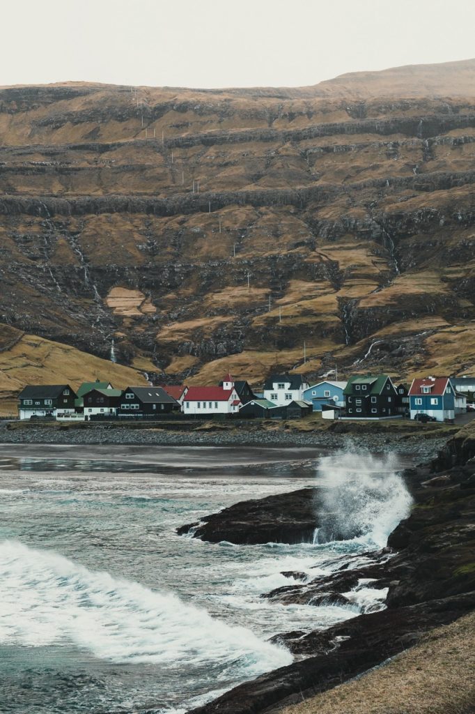 Waves crashing against the shore in Tjørnuvík, Faroe Islands